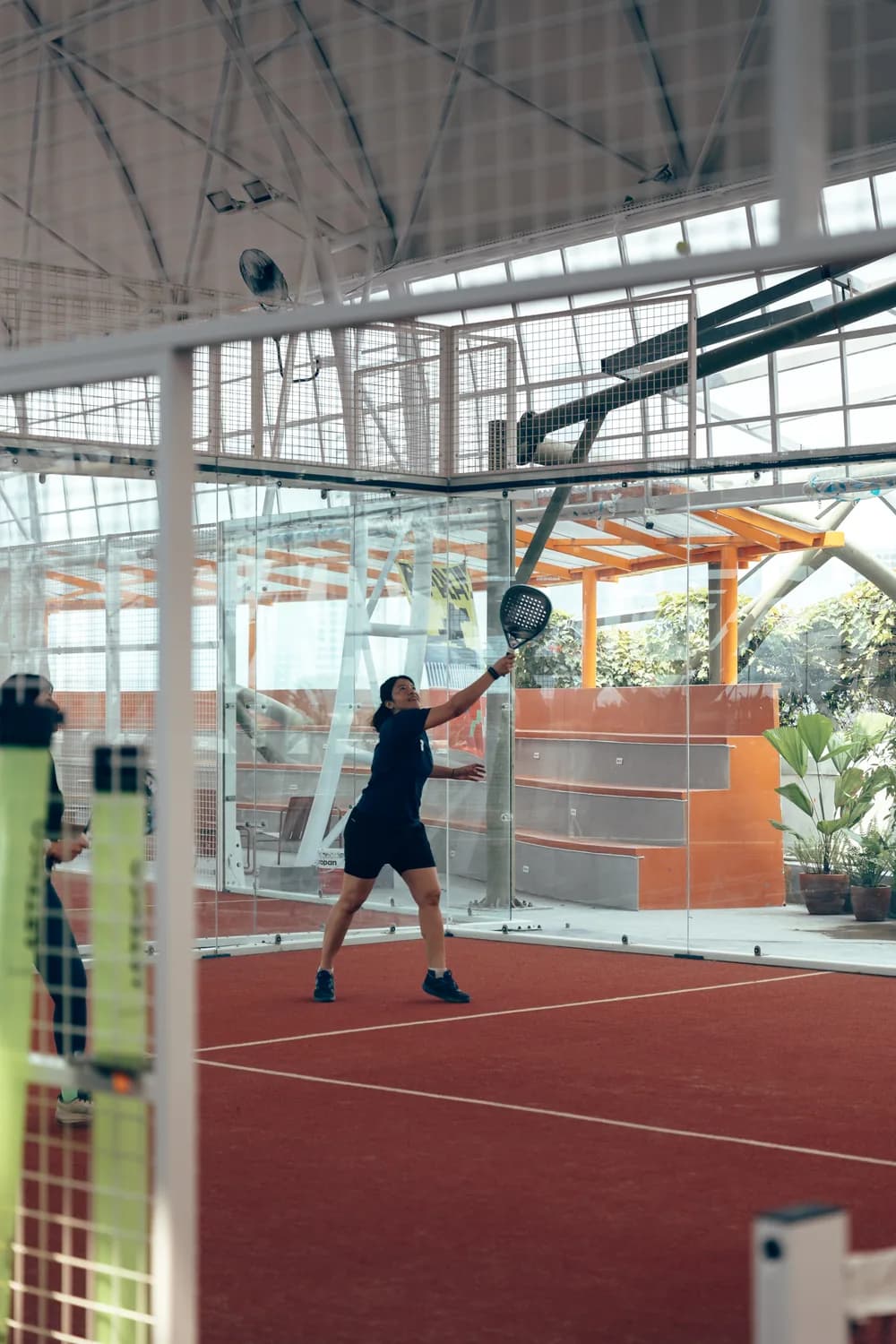 A doubles game on the courts at PPPLATZ